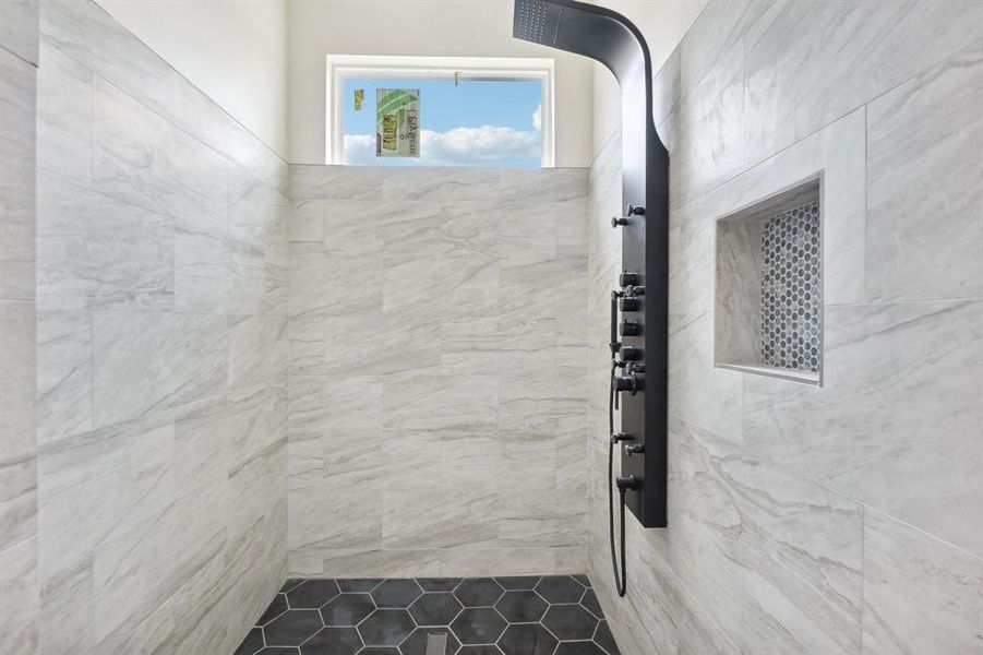 Bathroom with a tile shower