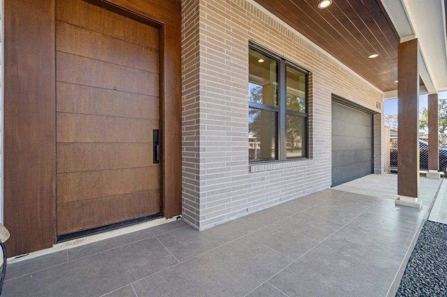 Offering this amazing, covered porch with its 8' solid front door, wood ceiling covering and a great curb appeal.