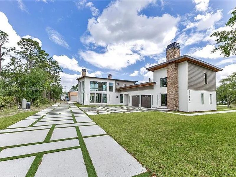 Front exterior of a new home in , Orlando, FL, highlighting curb appeal (Image 2). Front exterior of a new home in , Orlando, FL, highlighting curb appeal (Image 2).