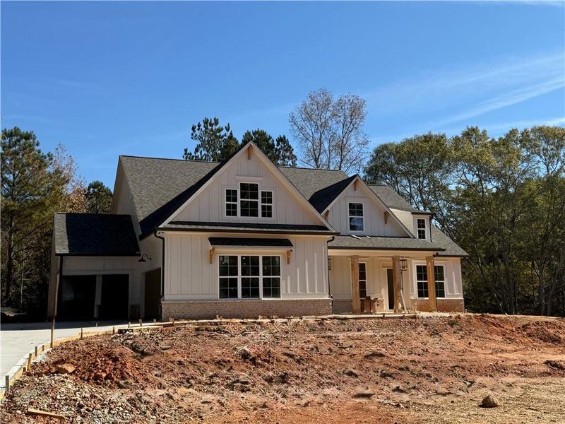 Front exterior of a new home in , Winder, GA, highlighting curb appeal (Image 1).