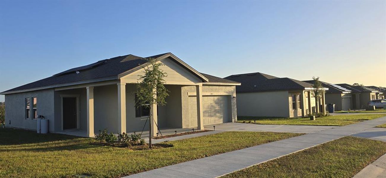 Front exterior of a new home in , Lake Wales, FL, highlighting curb appeal (Image 19). Front exterior of a new home in , Lake Wales, FL, highlighting curb appeal (Image 19).