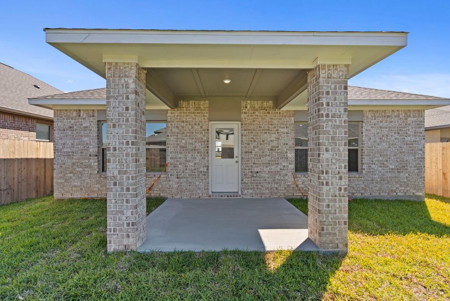 Exterior details and patio area of a home in Windrose Green, Angleton (Image 24).
