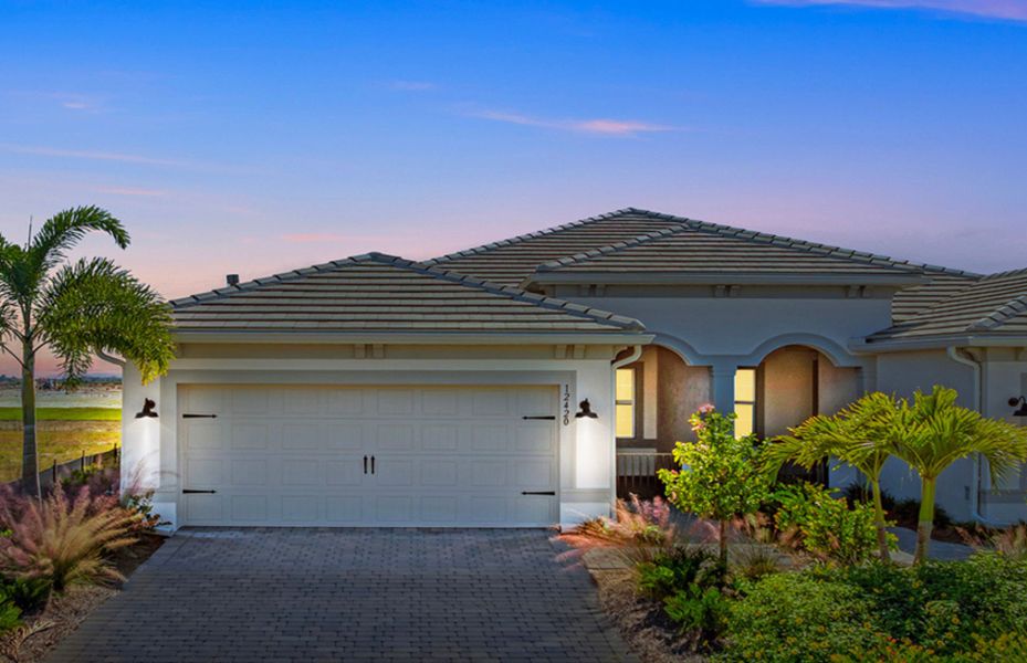 Front exterior of a new home in TerraWalk at Babcock Ranch, Alva, FL, highlighting curb appeal (Image 1). Front exterior of a new home in TerraWalk at Babcock Ranch, Alva, FL, highlighting curb appeal (Image 1).