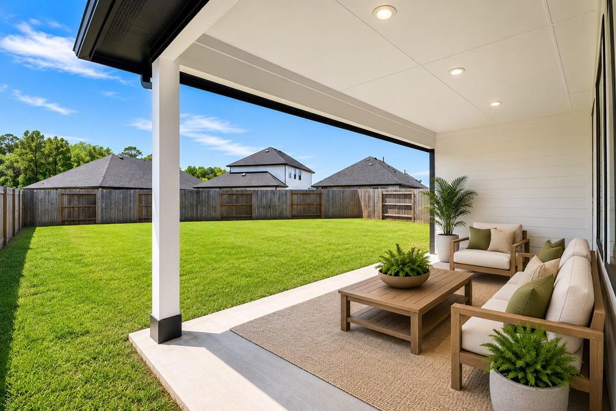 A spacious covered patio extends the living space outdoors, with plenty of room for dining, lounging or weekend cookouts while overlooking the backyard. *virtually staged*