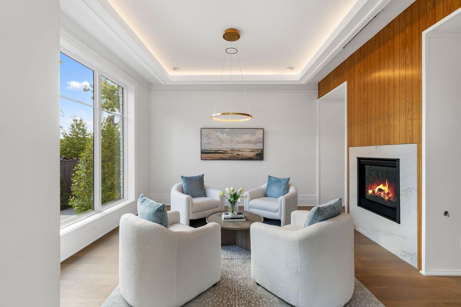 Formal living or optional study with double sided gas fireplace.