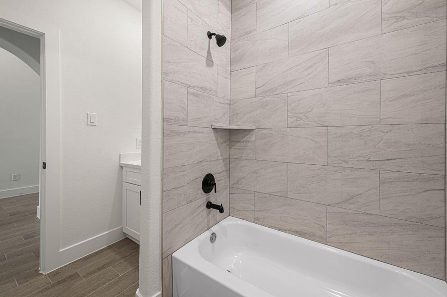 Guest bathroom with tub and shower