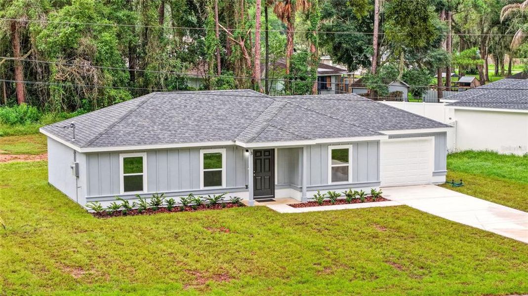Front exterior of a new home in , Ocala, FL, highlighting curb appeal (Image 18). Front exterior of a new home in , Ocala, FL, highlighting curb appeal (Image 18).