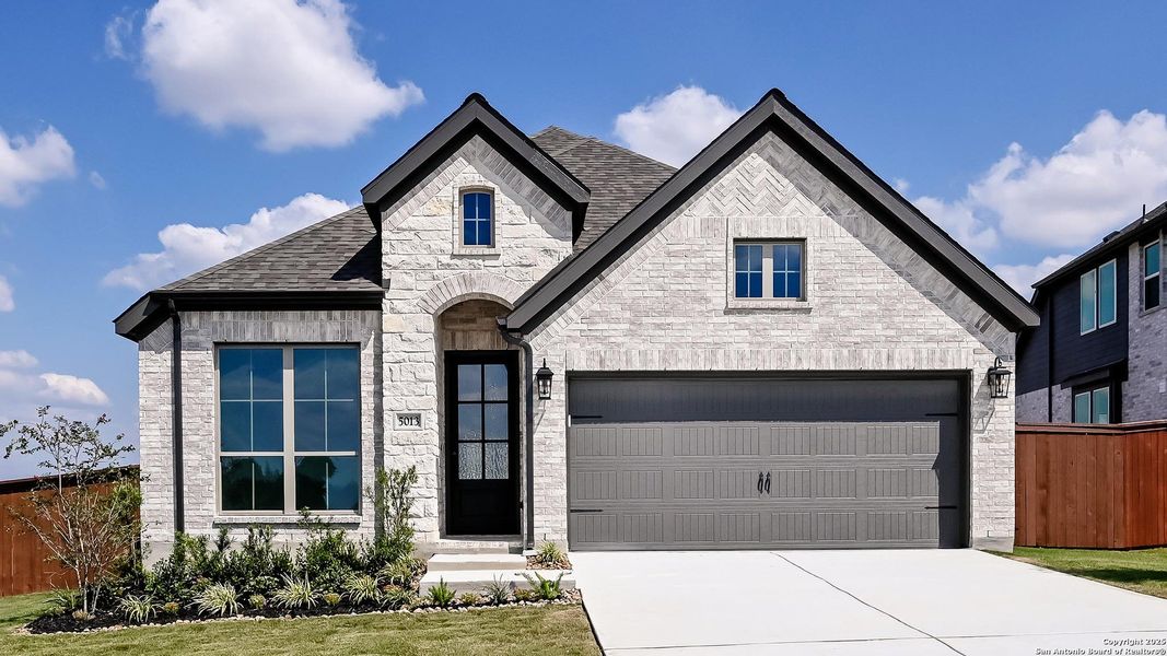 Front exterior of a new home in Homestead 55', Cibolo, TX, highlighting curb appeal (Image 2).