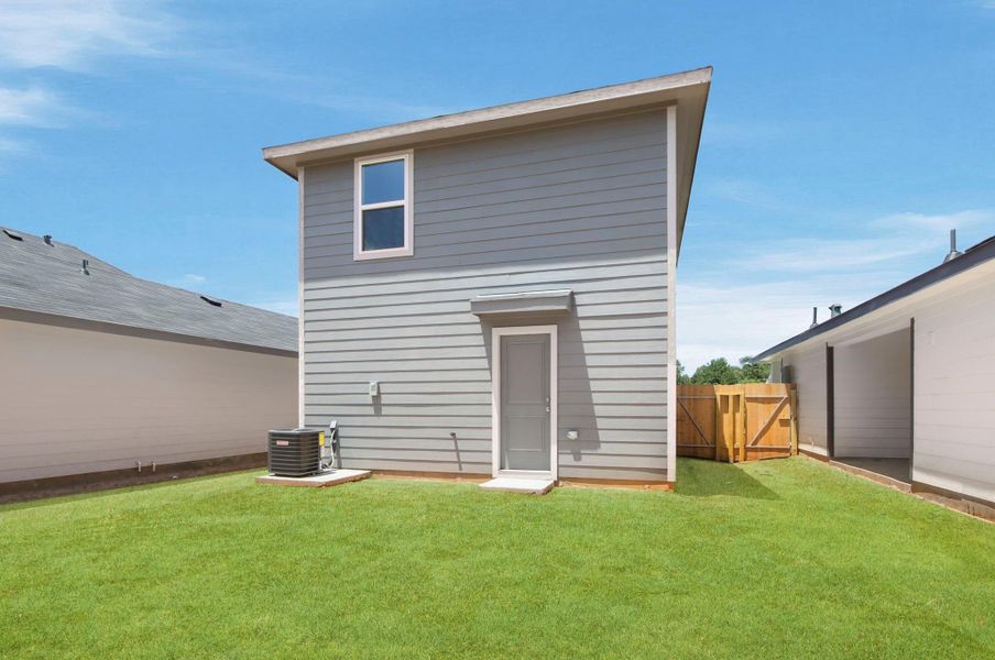 Exterior details and patio area of a home in Baron Village, Conroe (Image 4).