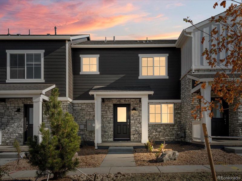Front exterior of a new home in Skyview at High Point, Aurora, CO, highlighting curb appeal (Image 2).