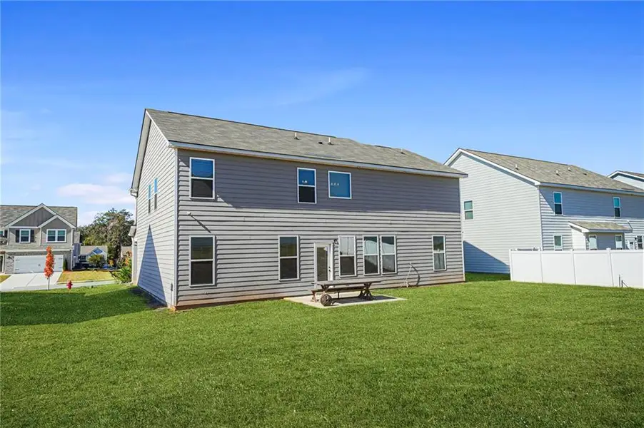 Exterior details and patio area of a home in Berkeley Lakes, Locust Grove (Image 3).