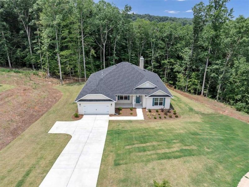 Front exterior of a new home in Tuscany Hills, Douglasville, GA, highlighting curb appeal (Image 23).