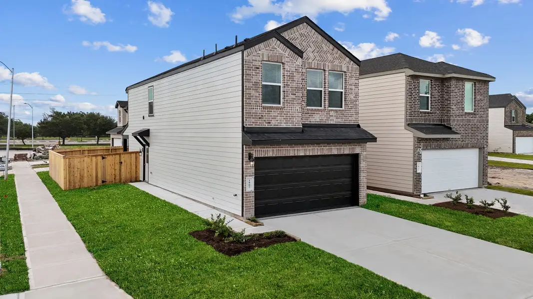 Front exterior of a new home in Lexington Village, Missouri City, TX, highlighting curb appeal (Image 2). Front exterior of a new home in Lexington Village, Missouri City, TX, highlighting curb appeal (Image 2).