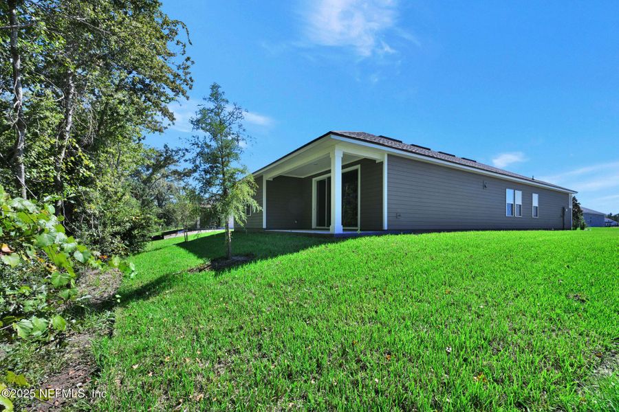 Exterior details and patio area of a home in McGirt's Creek, Yulee (Image 21).