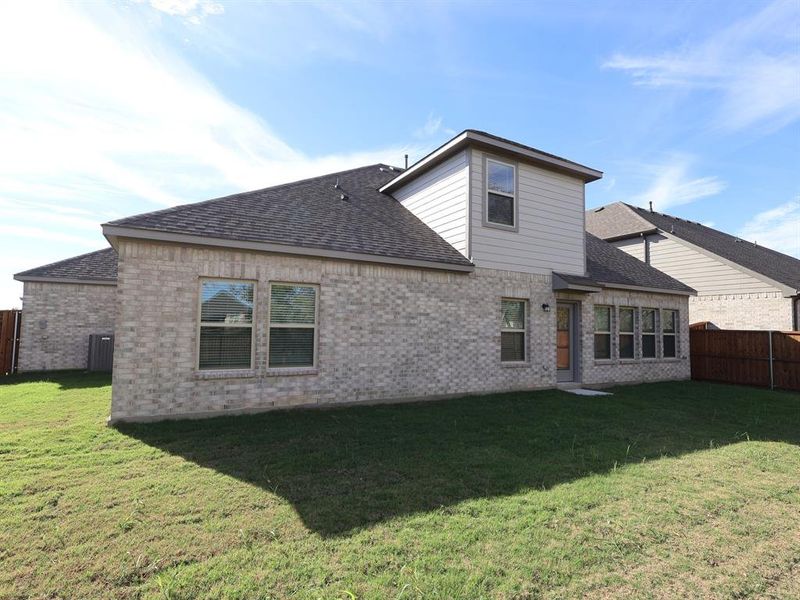 Exterior details and patio area of a home in The Preserve, Justin (Image 3).