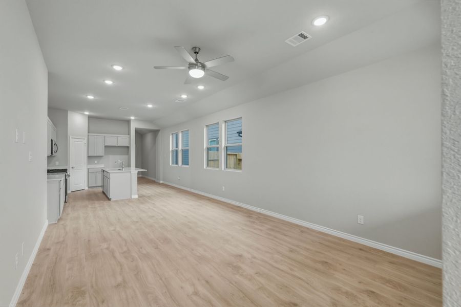 Dining and Living Area in the Cedar home plan by Trophy Signature Homes – REPRESENTATIVE PHOTO Dining and Living Area in the Cedar home plan by Trophy Signature Homes – REPRESENTATIVE PHOTO