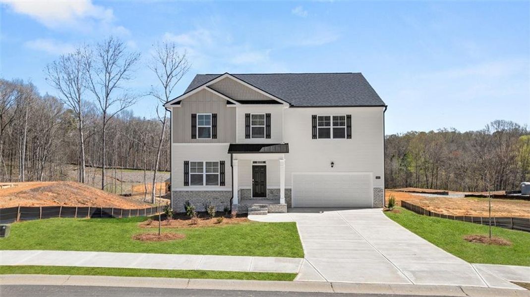 Front exterior of a new home in Kingston Ranch at Lake Oconee, Buckhead, GA, highlighting curb appeal (Image 21).