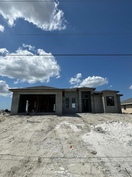Front exterior of a new home in , Cape Coral, FL, highlighting curb appeal (Image 2). Front exterior of a new home in , Cape Coral, FL, highlighting curb appeal (Image 2).