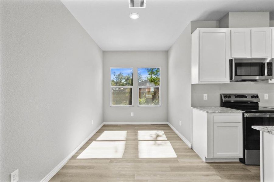 Sit down for family meals in this dining room offering plenty of space for a nice sized table.