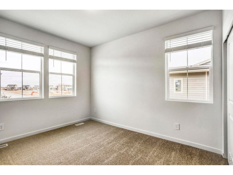 Spacious, unfurnished interior of a new home in Riano Ridge, Loveland (Image 11).