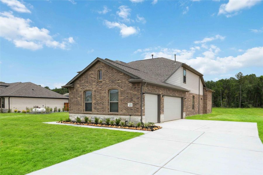 This home is located in the Barton Place acreage community and is zoned to Tarkington ISD.
