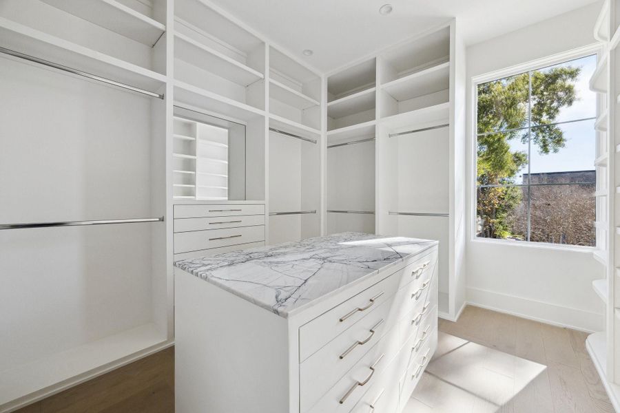 Primary Closet with a Center Packing Island.