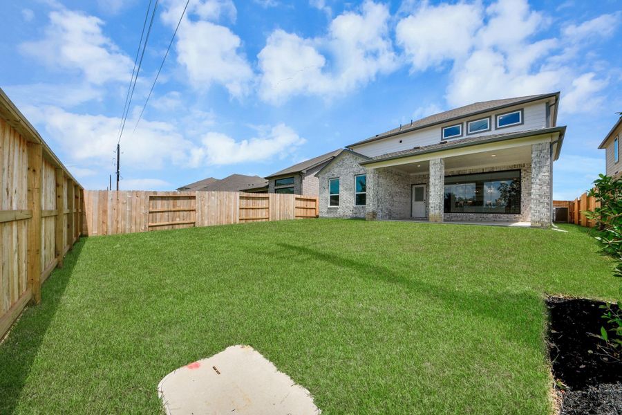 Backyard retreat, offering an abundance of space for kids to play and explore. The possibilities are endless in this outdoor haven, where the joy of open-air activities and family gatherings awaits.