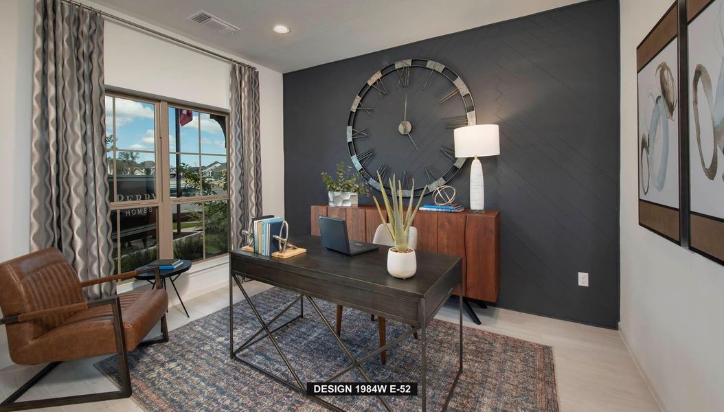 Home office featuring recessed lighting, light wood-style floors, and an accent wall