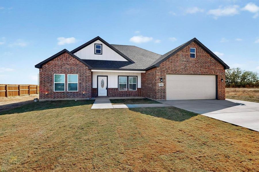 Front exterior of a new home in , Alma, TX, highlighting curb appeal (Image 1).