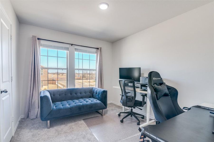 Office with light colored carpet and baseboards Office with light colored carpet and baseboards