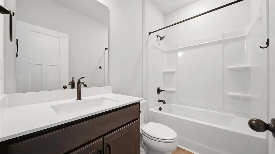 Top-notch bathroom with current fixtures, tasteful materials, and elevated charm located in Moore, SC