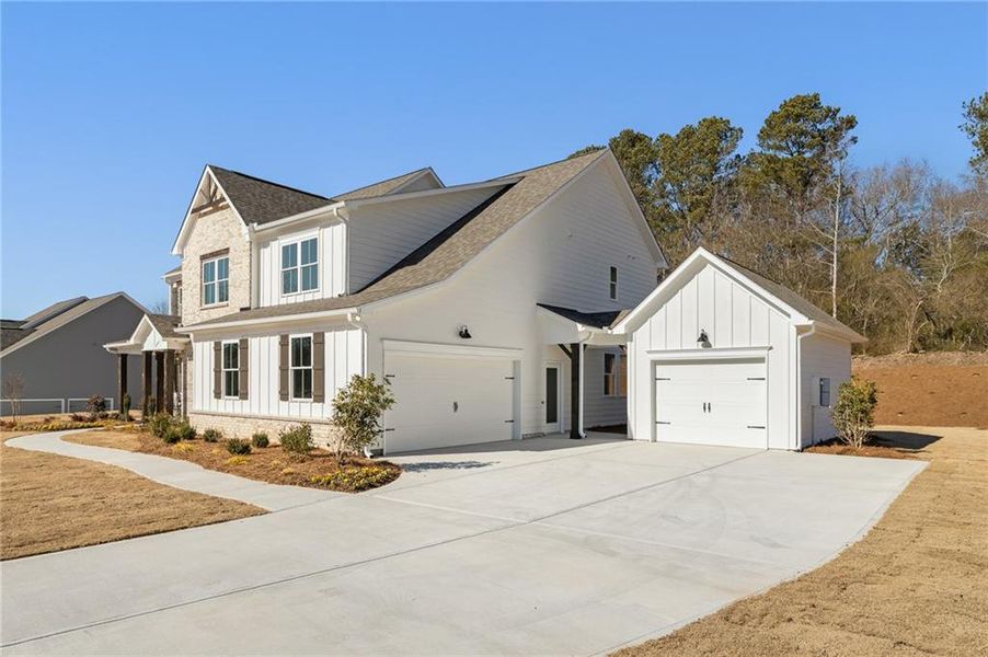 Front exterior of a new home in , Marietta, GA, highlighting curb appeal (Image 25).