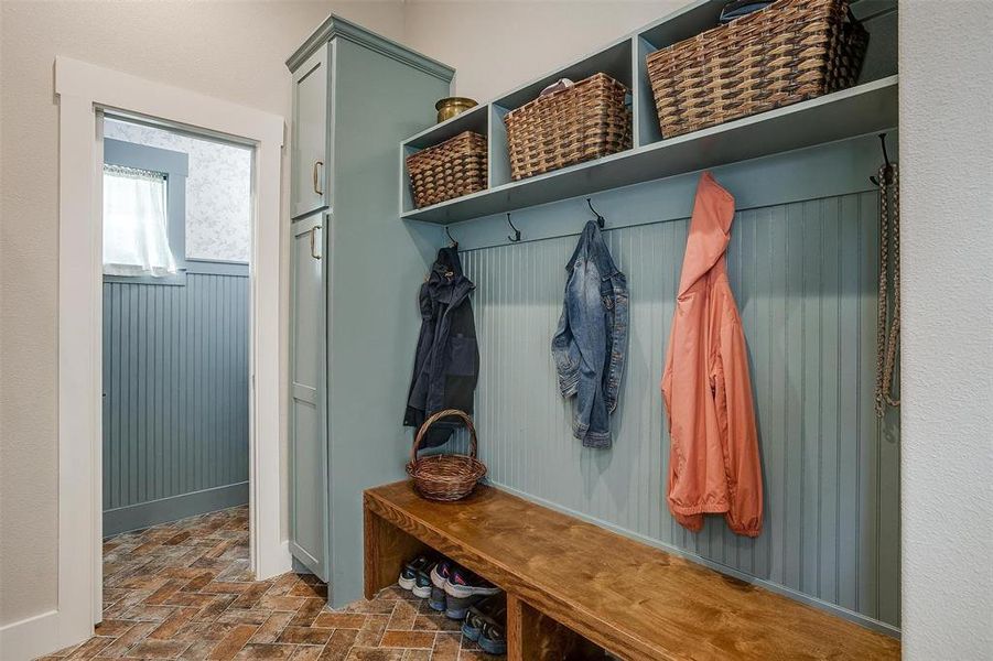 Mud room with built-in cabinets for extra storage. Mud room with built-in cabinets for extra storage.
