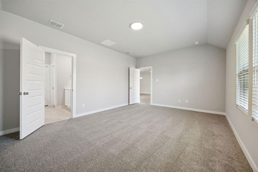 Primary Suite in the Oscar home plan by Trophy Signature Homes – REPRESENTATIVE PHOTO