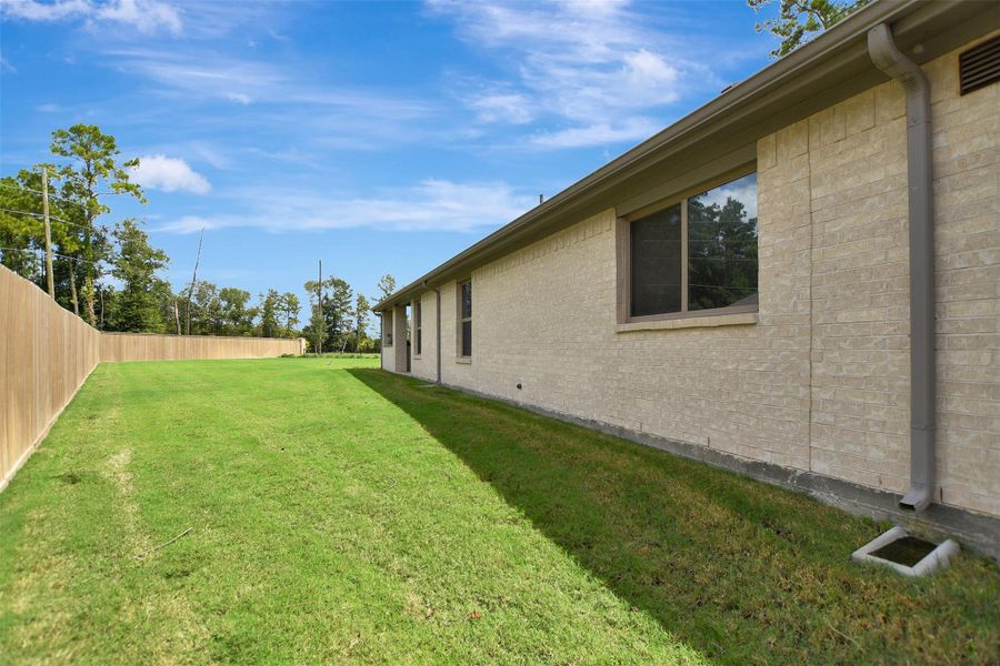 Exterior details and patio area of a home in The Highlands, Porter (Image 26).