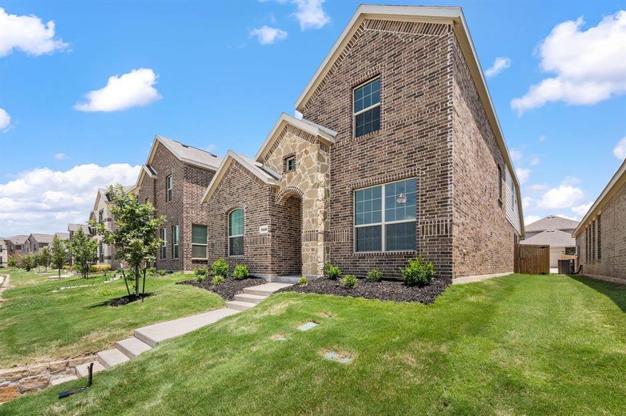 Front exterior of a new home in Northpointe, Fort Worth, TX, highlighting curb appeal (Image 2). Front exterior of a new home in Northpointe, Fort Worth, TX, highlighting curb appeal (Image 2).