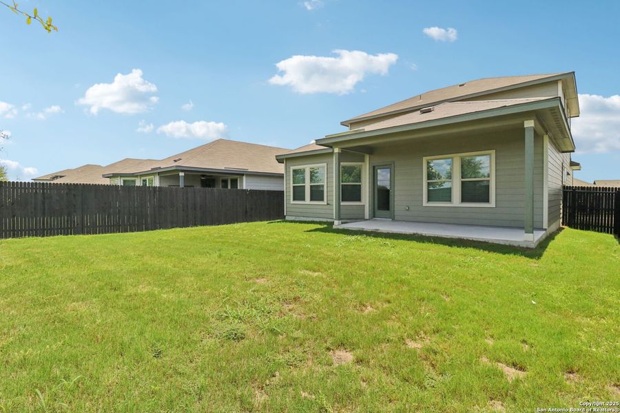 Front exterior of a new home in Remington Ranch, San Antonio, TX, highlighting curb appeal (Image 23). Front exterior of a new home in Remington Ranch, San Antonio, TX, highlighting curb appeal (Image 23).