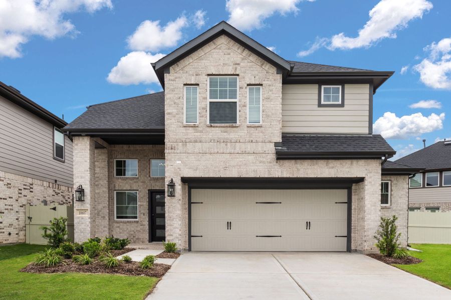 Front exterior of a new home in The Woodlands Hills, Willis, TX, highlighting curb appeal (Image 24).