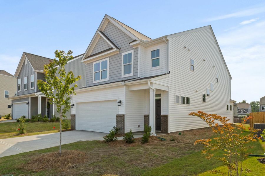 Front exterior of a new home in Harrington, Greenville, SC, highlighting curb appeal (Image 2). Front exterior of a new home in Harrington, Greenville, SC, highlighting curb appeal (Image 2).