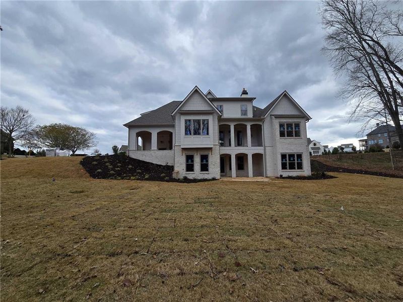 Front exterior of a new home in , Flowery Branch, GA, highlighting curb appeal (Image 6).