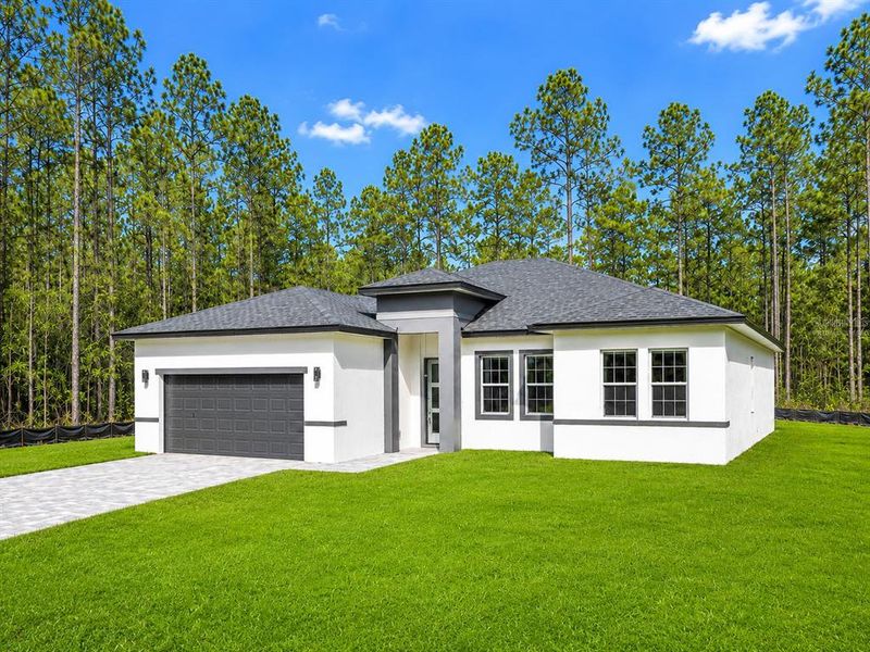 Front exterior of a new home in , Ocala, FL, highlighting curb appeal (Image 2). Front exterior of a new home in , Ocala, FL, highlighting curb appeal (Image 2).