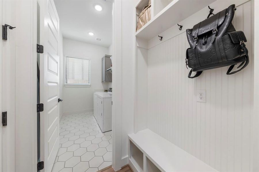 Through the utility room, you’ll find easy access to the mudroom, conveniently located directly across from the garage door.