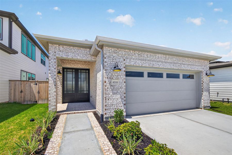 Front exterior of a new home in , Stafford, TX, highlighting curb appeal (Image 1). Front exterior of a new home in , Stafford, TX, highlighting curb appeal (Image 1).