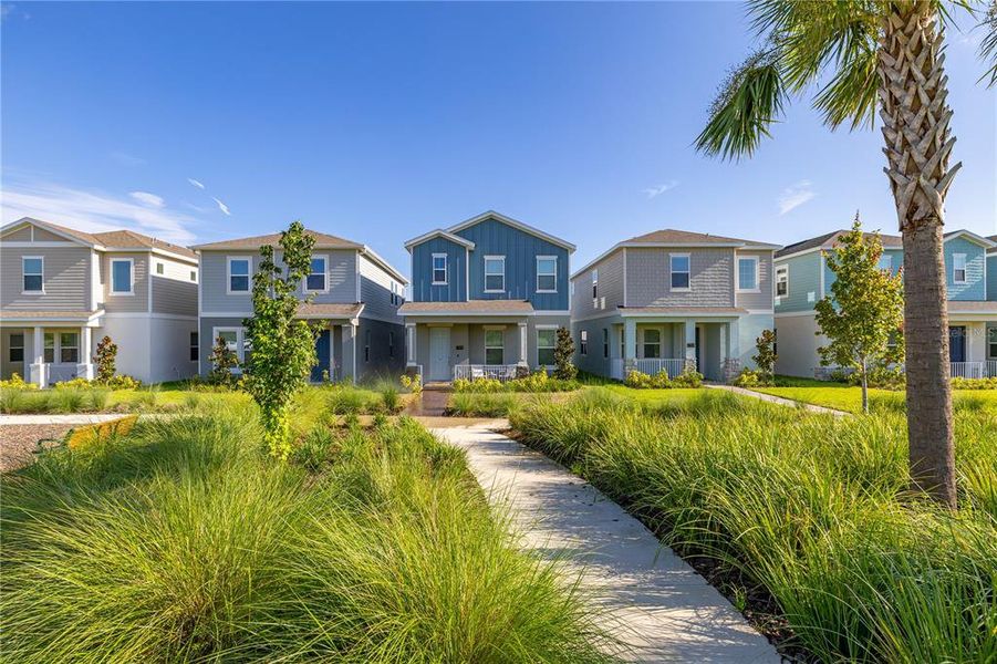 Front exterior of a new home in Serenade at Ovation, Winter Garden, FL, highlighting curb appeal (Image 19). Front exterior of a new home in Serenade at Ovation, Winter Garden, FL, highlighting curb appeal (Image 19).