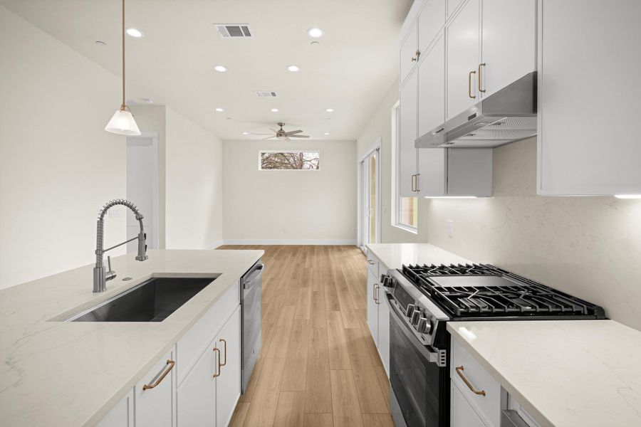 Spice rack, trash cans drawer, and many more upgrades in this home.