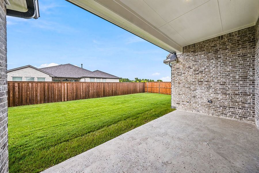 Exterior details and patio area of a home in The Homestead - 62', Rockwall (Image 3). Exterior details and patio area of a home in The Homestead - 62', Rockwall (Image 3).
