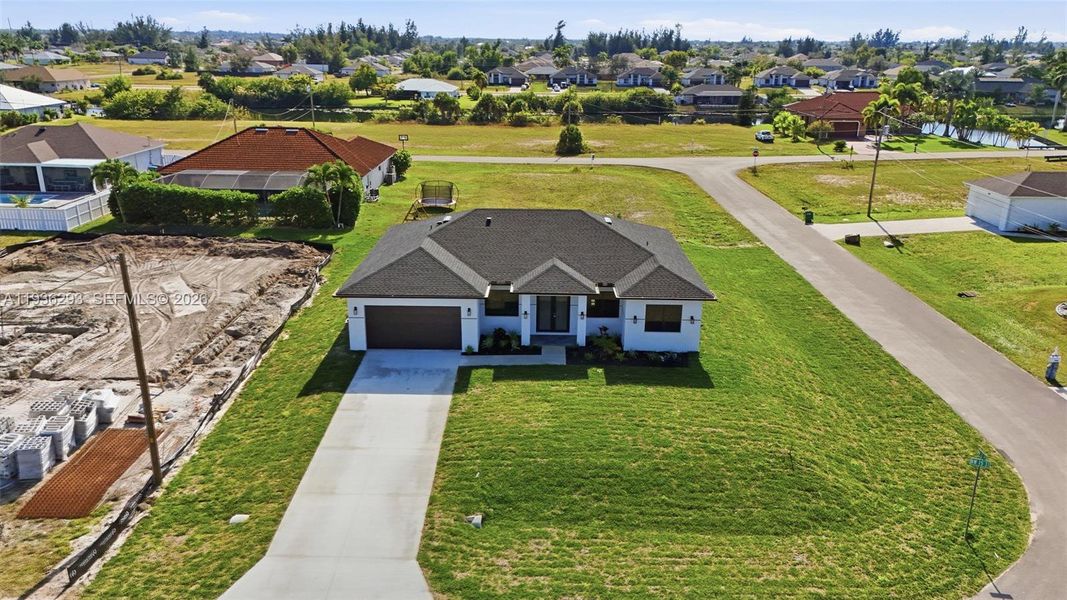 Front exterior of a new home in , Cape Coral, FL, highlighting curb appeal (Image 26).