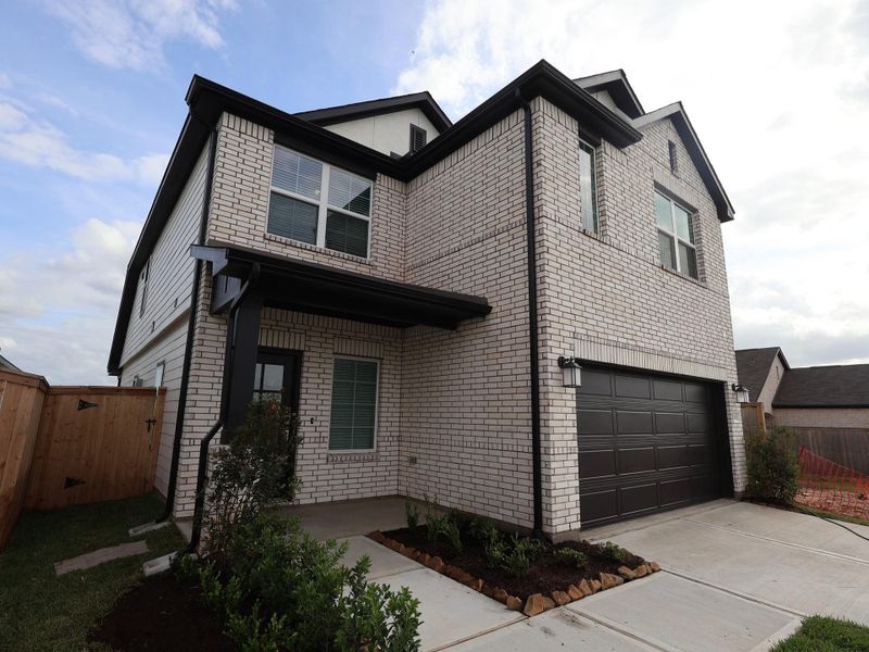 Front exterior of a new home in Summerview, Fulshear, TX, highlighting curb appeal (Image 1). Front exterior of a new home in Summerview, Fulshear, TX, highlighting curb appeal (Image 1).