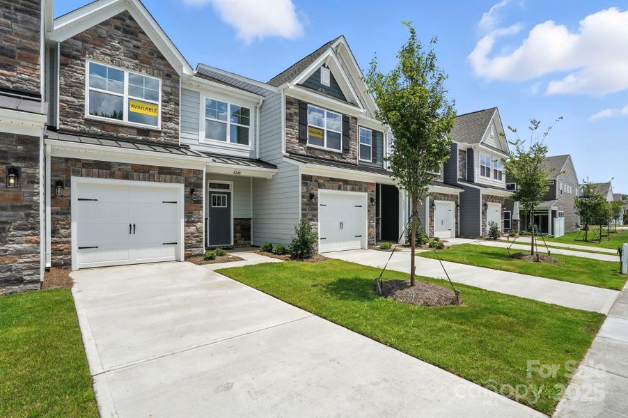 Front exterior of a new home in Harrisburg Village Townhomes, Harrisburg, NC, highlighting curb appeal (Image 19).