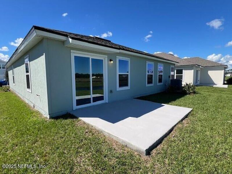 Exterior details and patio area of a home in Sawmill Branch Express, Palm Coast (Image 28).